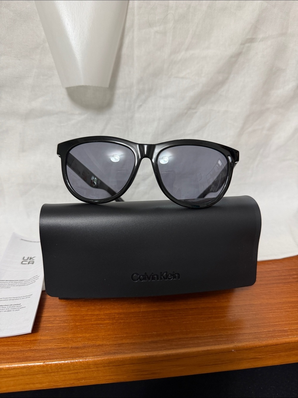 Calvin Klein Glossy Black Sunglasses with Smoke Lenses